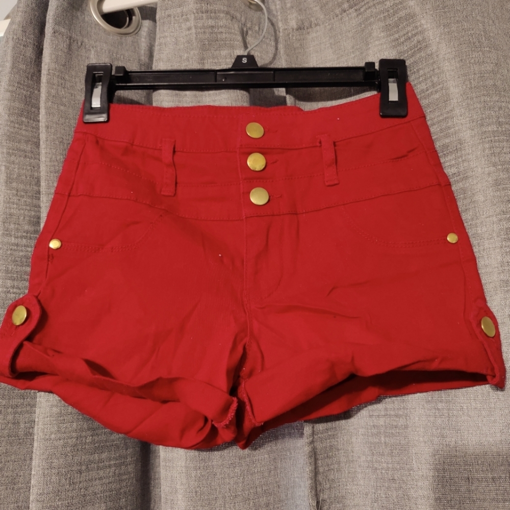 Women's red shorts with gold buttons
